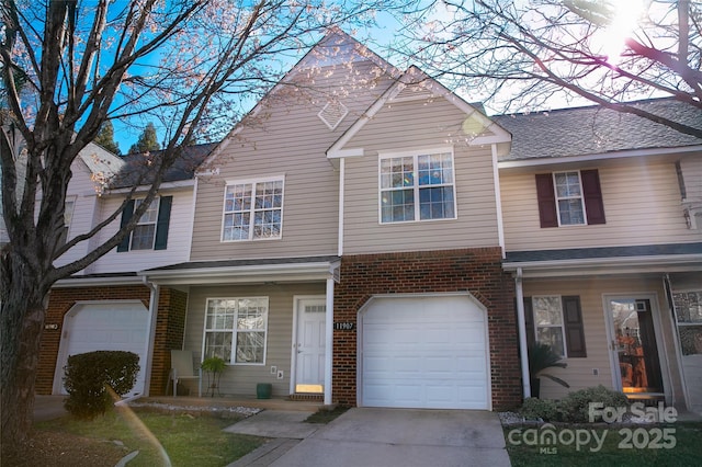 11907 Maria Ester Ct, Charlotte, NC 28277 - townhome / multi-family property with driveway, brick siding, and a garage