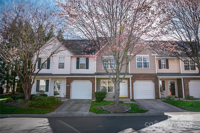 11907 Maria Ester Ct, Charlotte, NC 28277 - view of property featuring a garage, brick siding, and concrete driveway