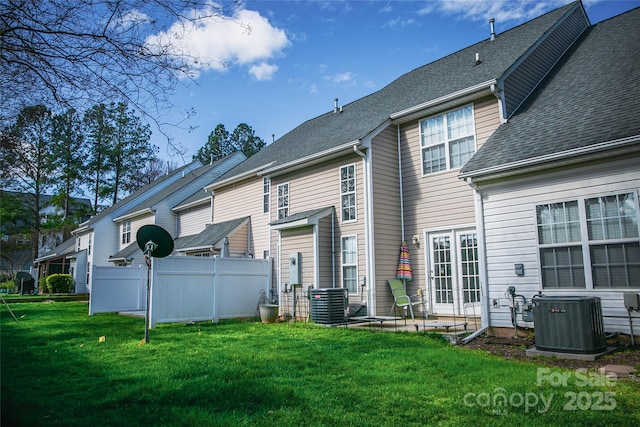 11907 Maria Ester Ct, Charlotte, NC 28277 - back of property with a lawn, a shingled roof, fence, and cooling unit