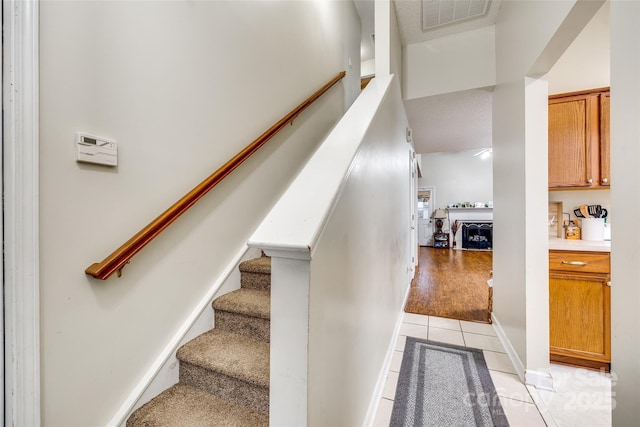 staircase with tile patterned flooring