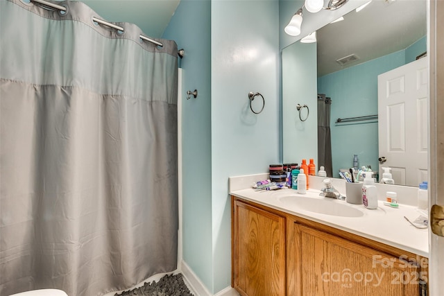 bathroom with vanity and a shower with shower curtain