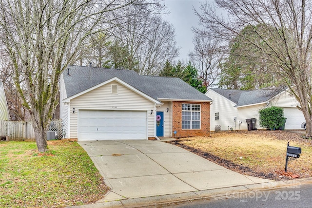 single story home featuring a garage, a front yard, and central air condition unit