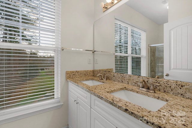 bathroom with vanity and an enclosed shower