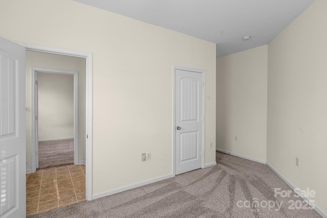 unfurnished bedroom with light carpet