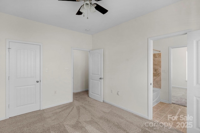 unfurnished bedroom featuring ceiling fan and light carpet