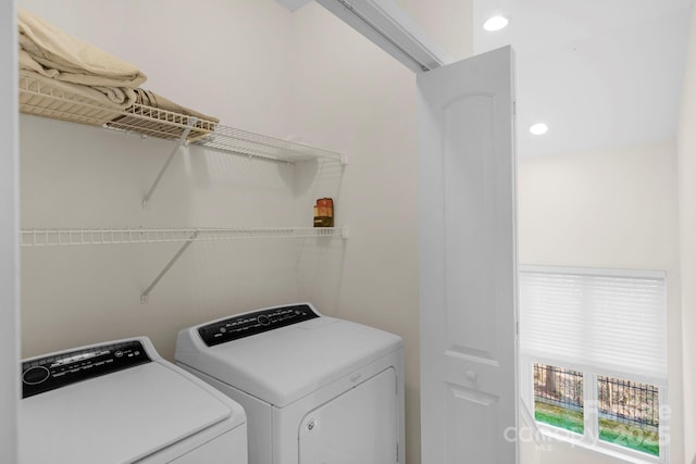 washroom featuring washing machine and clothes dryer