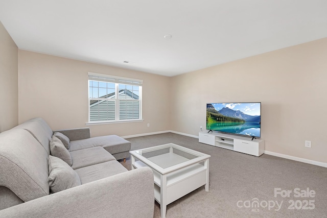 living room with carpet and baseboards