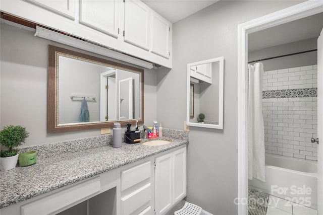 full bathroom featuring shower / bathtub combination with curtain and vanity