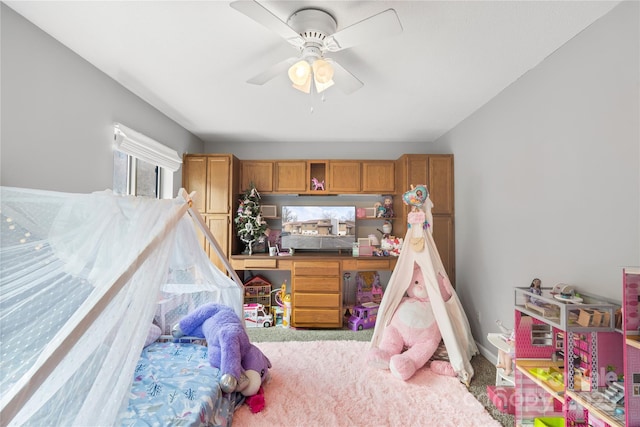 bedroom with ceiling fan and carpet floors