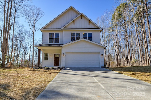 view of front of property featuring a garage, board and batten siding, and concrete driveway