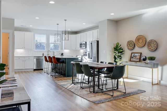 dining room with light wood-type flooring