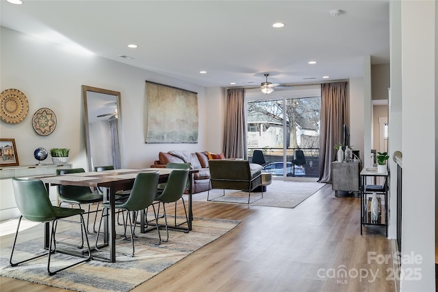 dining space featuring light hardwood / wood-style flooring and ceiling fan