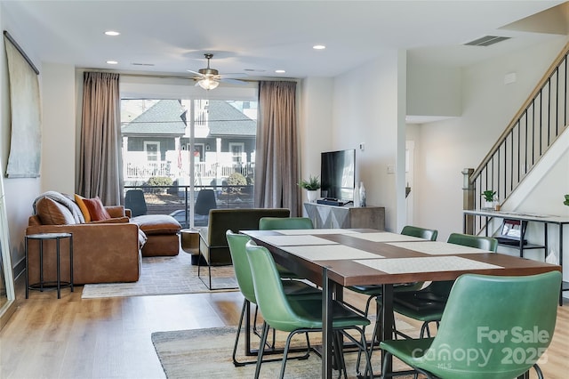 dining area featuring ceiling fan and light hardwood / wood-style flooring