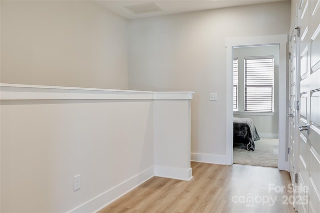 hallway featuring light wood-type flooring