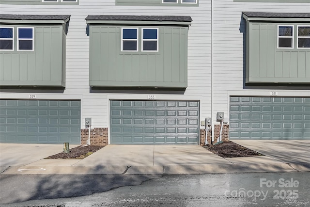 view of side of home with a garage