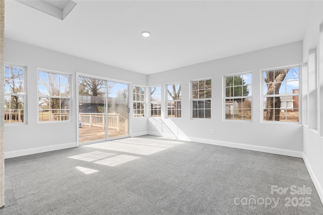 unfurnished sunroom featuring a healthy amount of sunlight