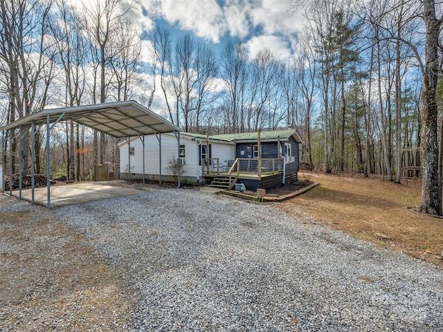 view of front of home featuring a carport and a deck