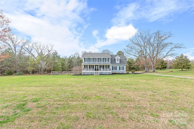 view of front of home with a porch and a front lawn