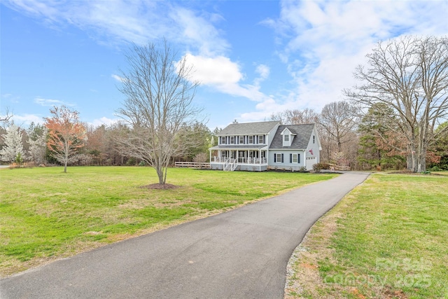 view of front of home with a porch and a front yard