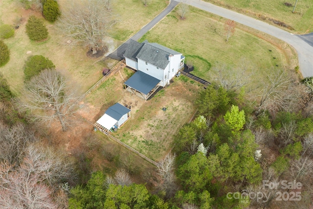 birds eye view of property featuring a rural view