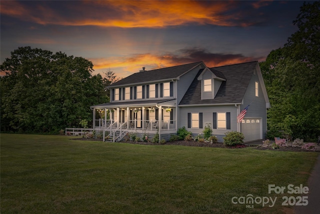 back of property at dusk featuring a lawn, a porch, a shingled roof, and an attached garage