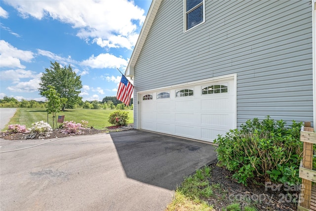 garage with aphalt driveway