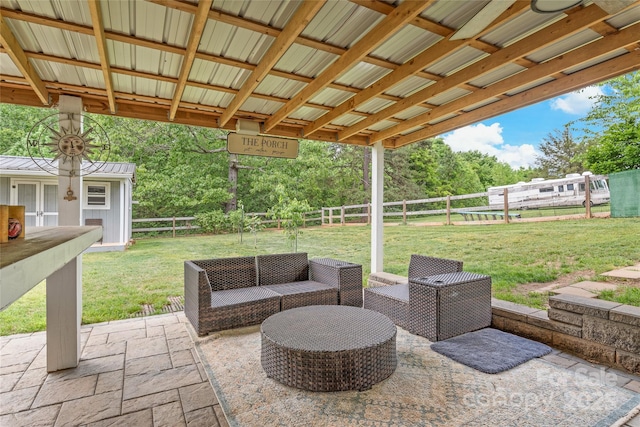 view of patio featuring an outbuilding and a fenced backyard