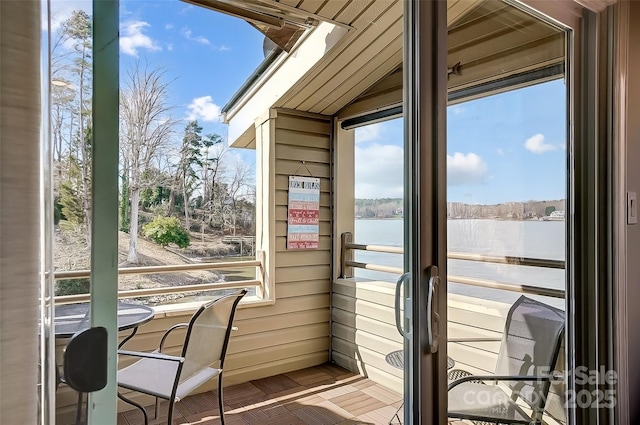 sunroom with a water view