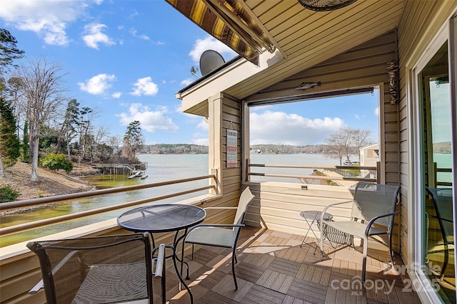 balcony featuring a water view