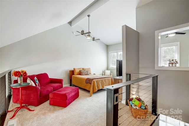 carpeted bedroom with lofted ceiling with beams