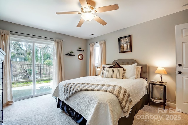 bedroom with light carpet, ceiling fan, multiple windows, and access to exterior