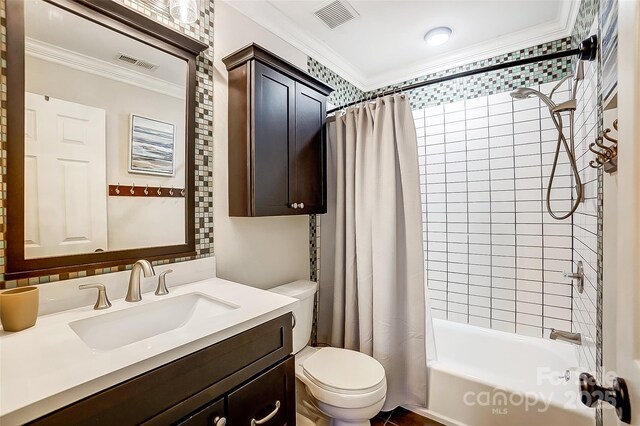 bathroom with toilet, visible vents, shower / bath combo, and ornamental molding