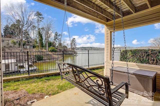 view of patio featuring fence