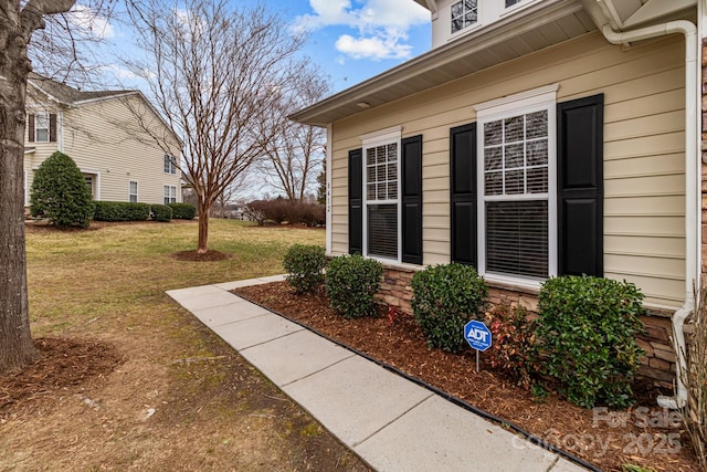 entrance to property featuring a yard