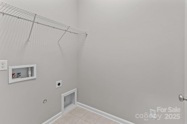 clothes washing area with washer hookup, hookup for an electric dryer, and light tile patterned floors