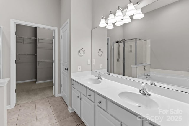 bathroom featuring vanity, plus walk in shower, and tile patterned flooring