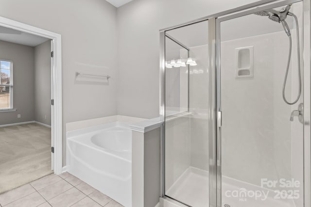 bathroom with tile patterned floors and plus walk in shower