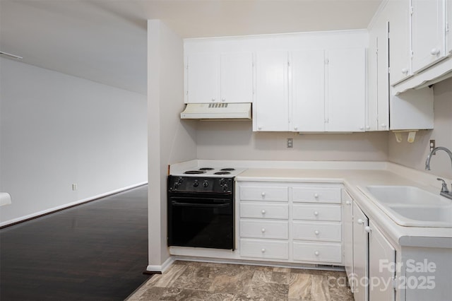 kitchen featuring white cabinetry, sink, and electric range