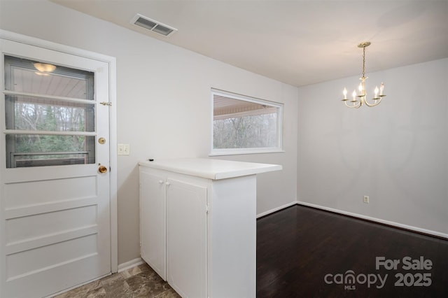 interior space with a chandelier