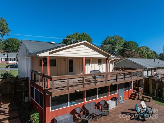 back of property with a wooden deck