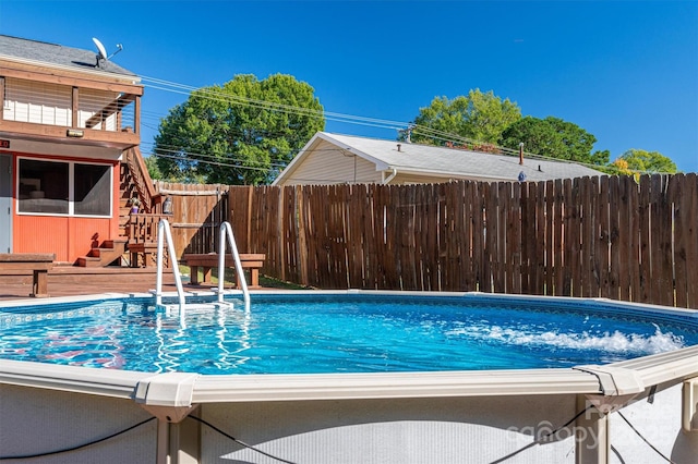 view of swimming pool featuring a deck