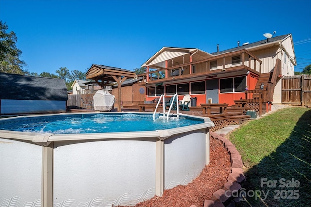 view of pool featuring a lawn and a shed