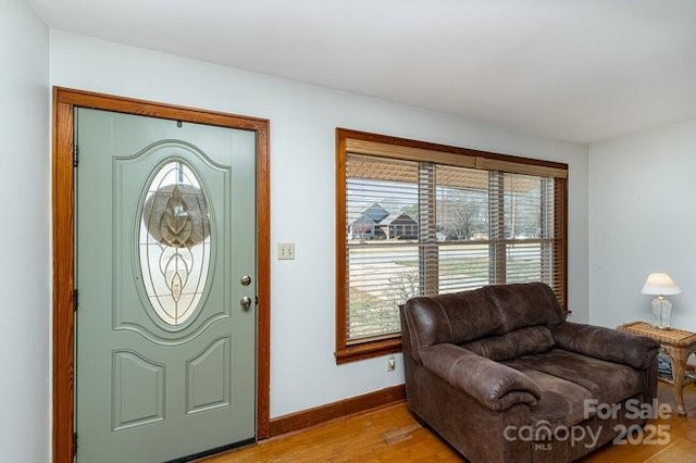 entrance foyer featuring light wood-style floors and baseboards