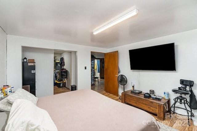 bedroom with a closet and wood finished floors