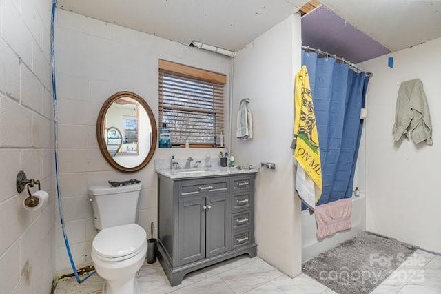 bathroom featuring marble finish floor, vanity, and toilet