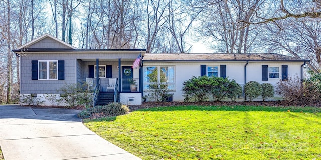 ranch-style house with a porch and a front yard