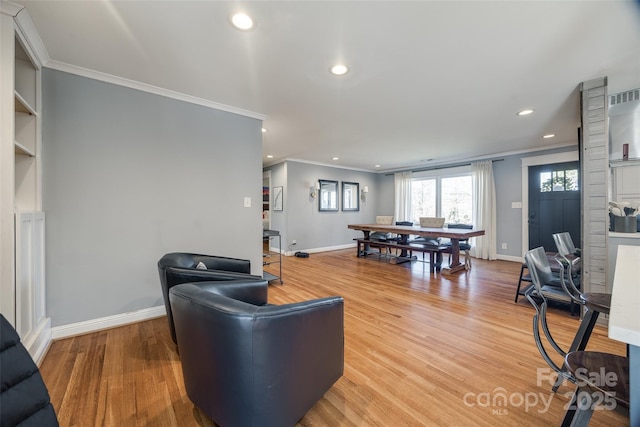 living room featuring ornamental molding and hardwood / wood-style floors