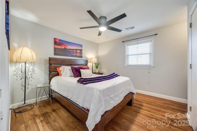 bedroom featuring hardwood / wood-style flooring and ceiling fan