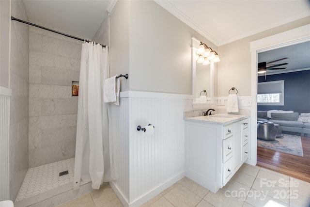 bathroom featuring crown molding, curtained shower, tile patterned floors, and vanity