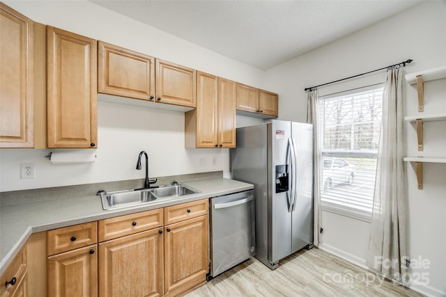 11426 Savannah Creek Dr, Charlotte, NC 28273 - kitchen with light wood-style floors, appliances with stainless steel finishes, light countertops, and a sink